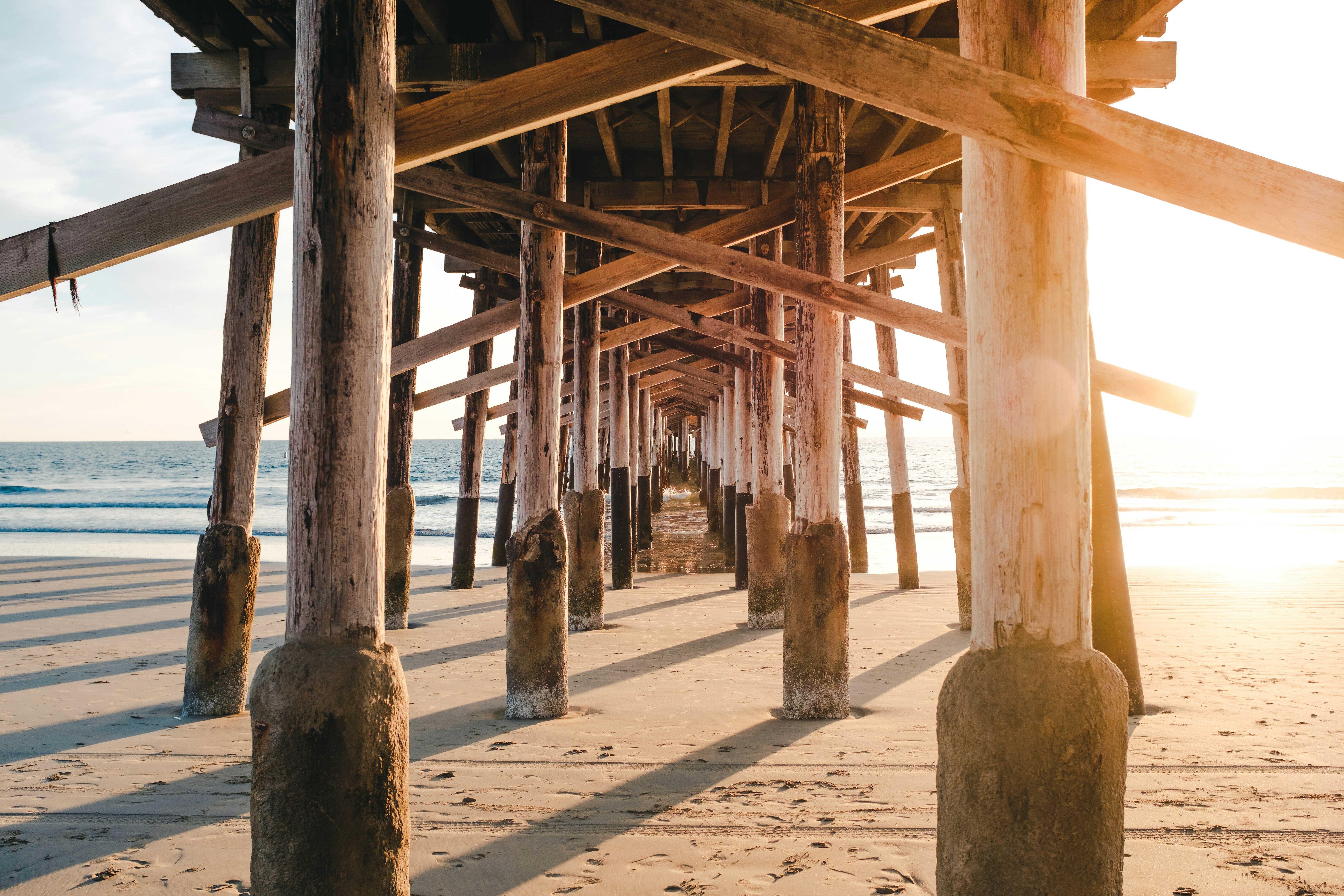 brown wooden bridge under of sand